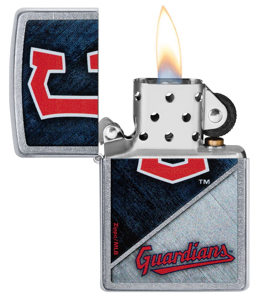 MLB™ Cleveland Guardians™ Street Chrome™ Windproof Lighter with its lid open and lit.