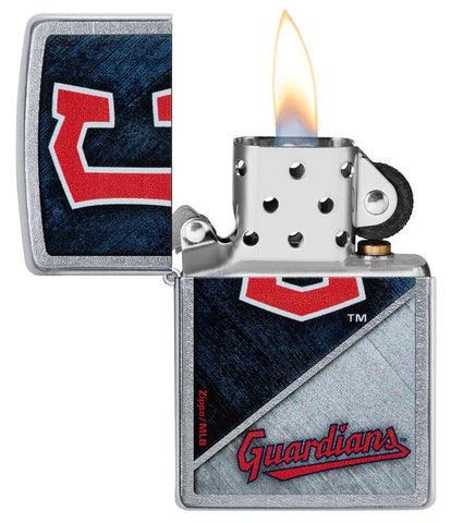MLB™ Cleveland Guardians™ Street Chrome™ Windproof Lighter with its lid open and lit.