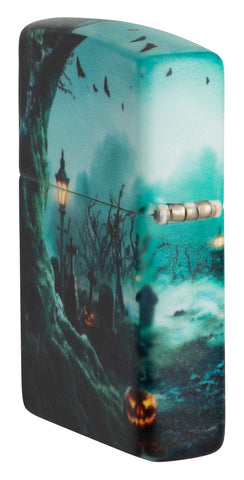 Zippo Graveyard Design 540 Color Windproof Lighter standing at an angle, showing the back and hinge side of the lighter.