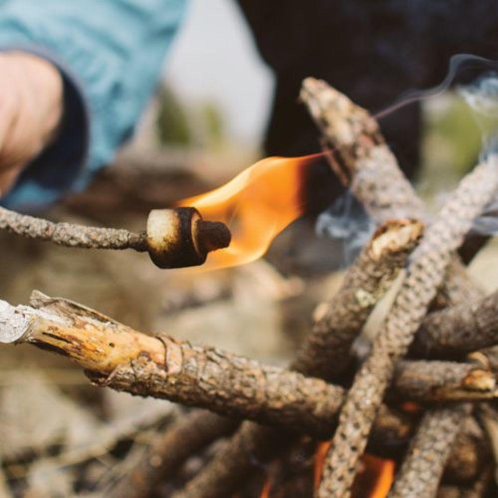 Front view of an Easy Spark Tinder roasting to start a fire
