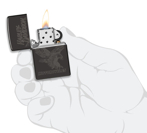 Zippo Harley-Davidson Laser Fancy Fill High Polish Black Windproof Lighter lit in hand.