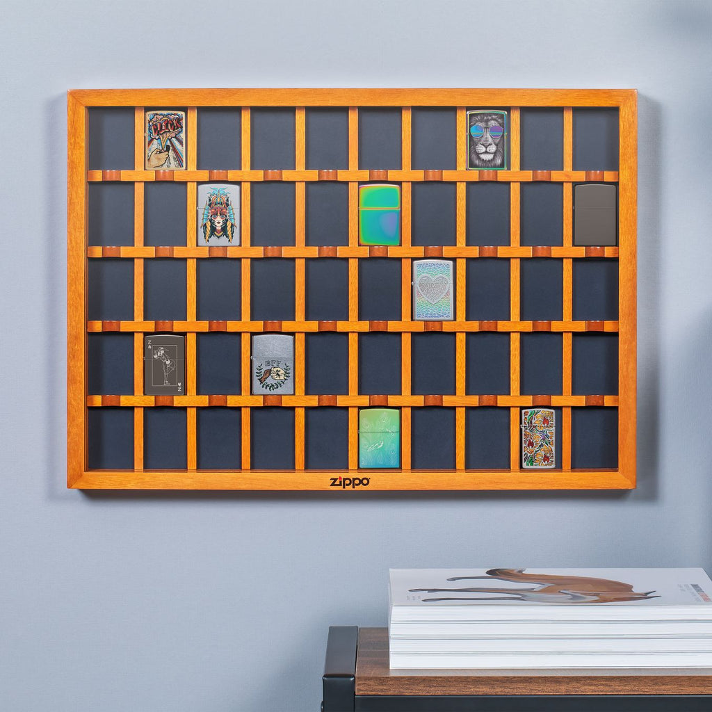 Lifestyle image of 50 Piece Brown Lighter Display Case handing on the wall with lighters in it.