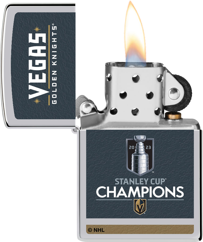 2023 Stanley Cup® Champions Vegas Golden Knights Windproof Lighter with its lid open and lit.