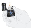 NFL Dallas Cowboys Windproof Lighter lit in hand.