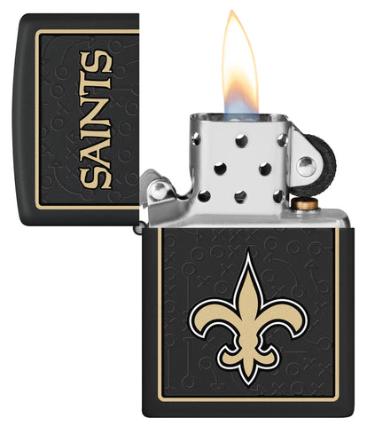 NFL New Orleans Saints Windproof Lighter lit in hand.