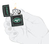 NFL New York Jets Windproof Lighter lit in hand.