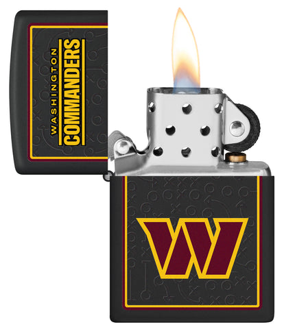 NFL Washington Commanders Windproof Lighter lit in hand.