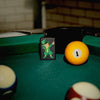 Lifestyle image of Dabbing Leprechaun Design Windproof Lighter standing on a pool table