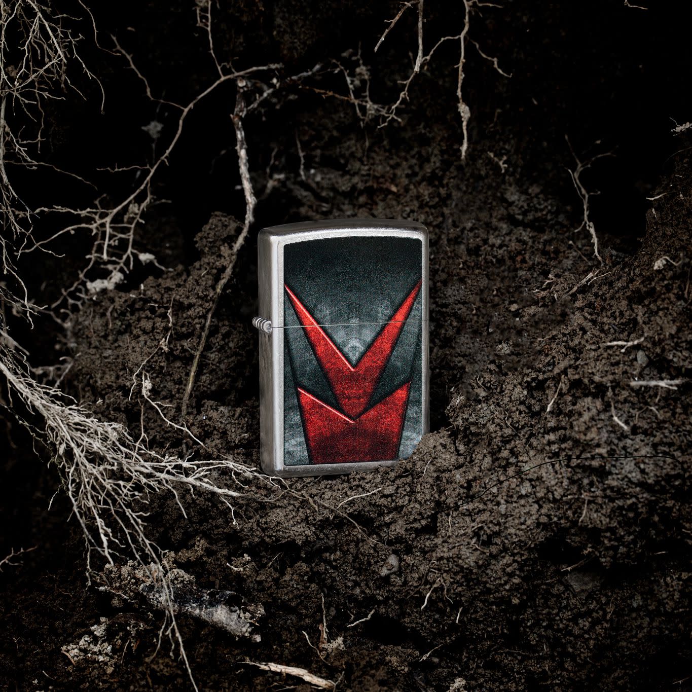 Lifestyle image of Zippo Metallic Pattern Design Street Chrome Windproof Lighter standing on rocks.