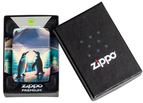 Zippo Penguin Design Glow in the Dark Green Matte Windproof Lighter in its packaging.