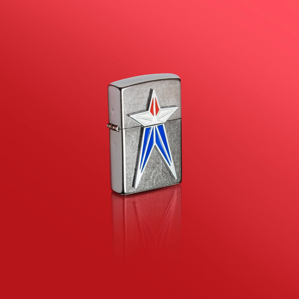 Lifestyle image of Zippo Red White and Blue Star Street Chrome Windproof Lighter standing in a red scene.