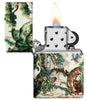 Zippo Jungle Design 540 Matte Windproof Lighter with its lid open and lit.