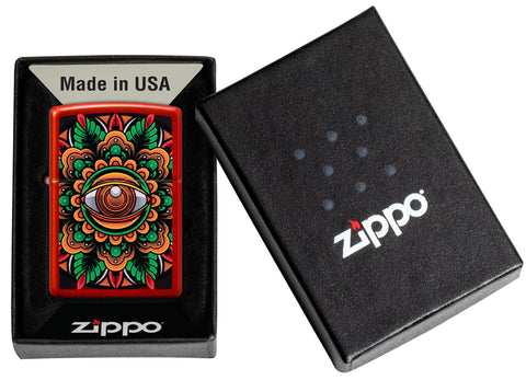 Zippo Counter Culture Eye Design Metallic Red Windproof Lighter in its packaging.