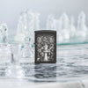 Lifestyle image of Zippo Chess Design High Polish Black Windproof Lighter sitting on a marble table with chess pieces.