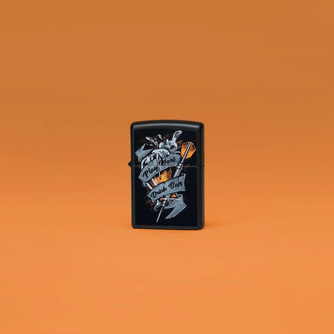 Lifestyle image of Zippo Darts Design Black Matte Windproof Lighter standing in an orange scene.
