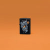 Lifestyle image of Zippo Darts Design Black Matte Windproof Lighter standing in an orange scene.