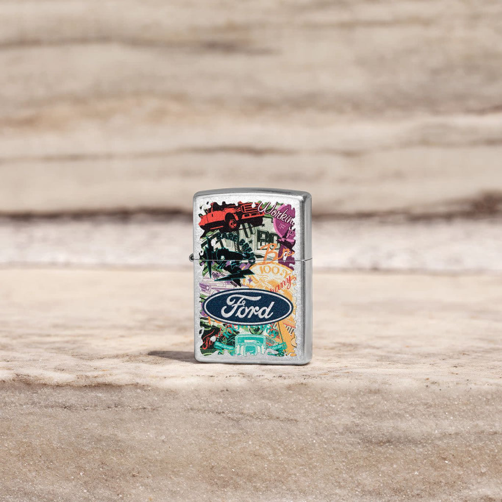 Lifestyle image of Zippo Ford Collage Street Chrome Pocket Lighter standing on stone.