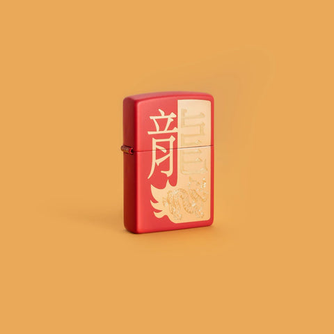 Lifestyle image of Zippo Year of the Dragon 2024 Red Matte Windproof Lighter on a yellow-orange background.