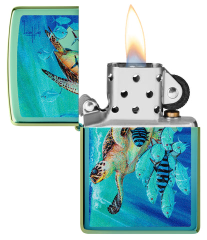 Zippo Guy Harvey High Polish Teal Windproof Lighter with its lid open and lit.