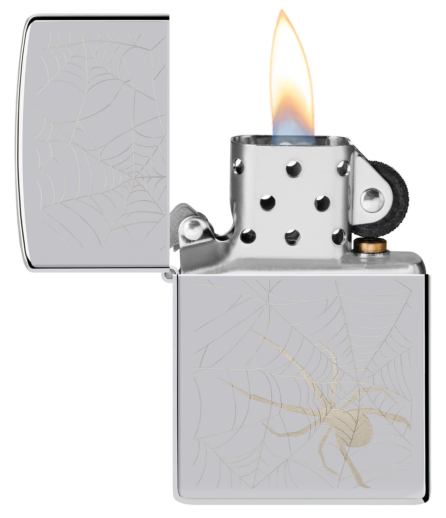 Zippo Spider Web Design High Polish Chrome Windproof Lighter with its lid open and lit.