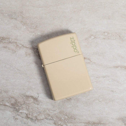 Lifestyle image of Classic Flat Sand Zippo Logo laying on a marble surface