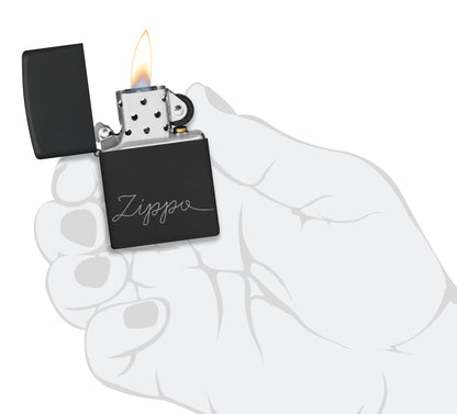 Zippo Design Black Matte with Chrome Windproof Lighter lit in hand.