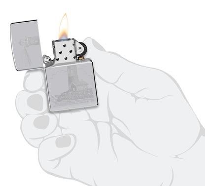 Zippo Lighthouse Design Highpolish Chrome Windproof Lighter lit in hand.