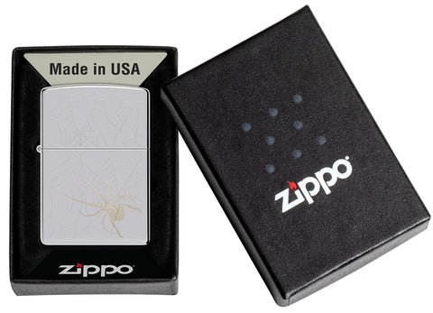 Zippo Spider Web Design High Polish Chrome Windproof Lighter in its packaging.