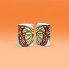 Lifestyle image of two Zippo Butterfly Design 540 Color Windproof Lighters standing in an orange scene.