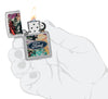 Zippo Ford Collage Street Chrome Pocket Lighter lit in hand.