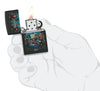 Zippo Black Light Rick Rietveld Design Black Martte Windproof Lighter lit in hand.