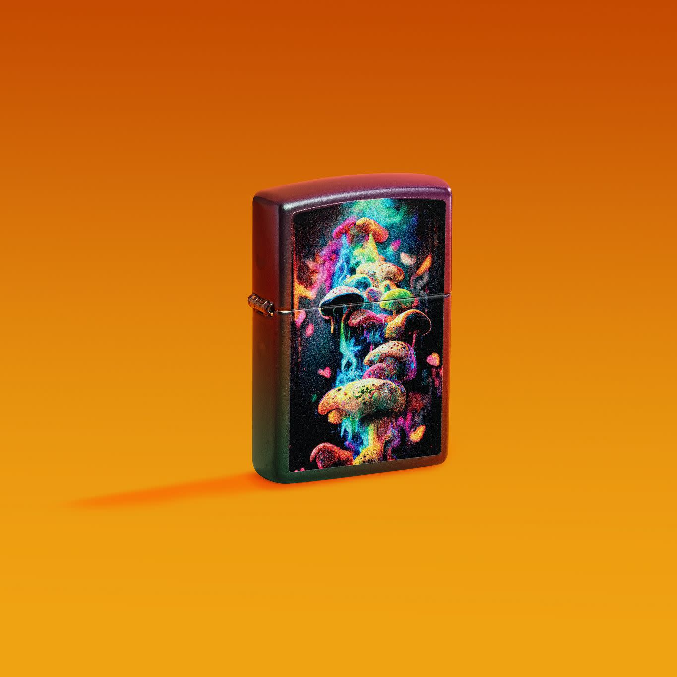 Lifestyle image of Zippo Mushrooms Design Iridescent Windproof Lighter on an orange ombre background.