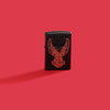 Lifestyle image of Zippo Harley-Davidson® Black Matte Windproof Lighter on a red background.