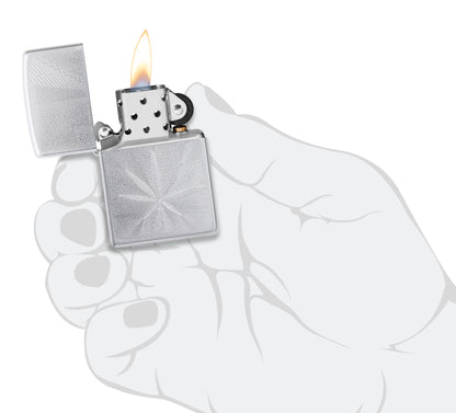 Zippo Luxury Leaf Design Satin Chrome Windproof Lighter lit in hand.