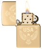 Zippo USA High Polish Brass Windproof Lighter with its lid open and lit.