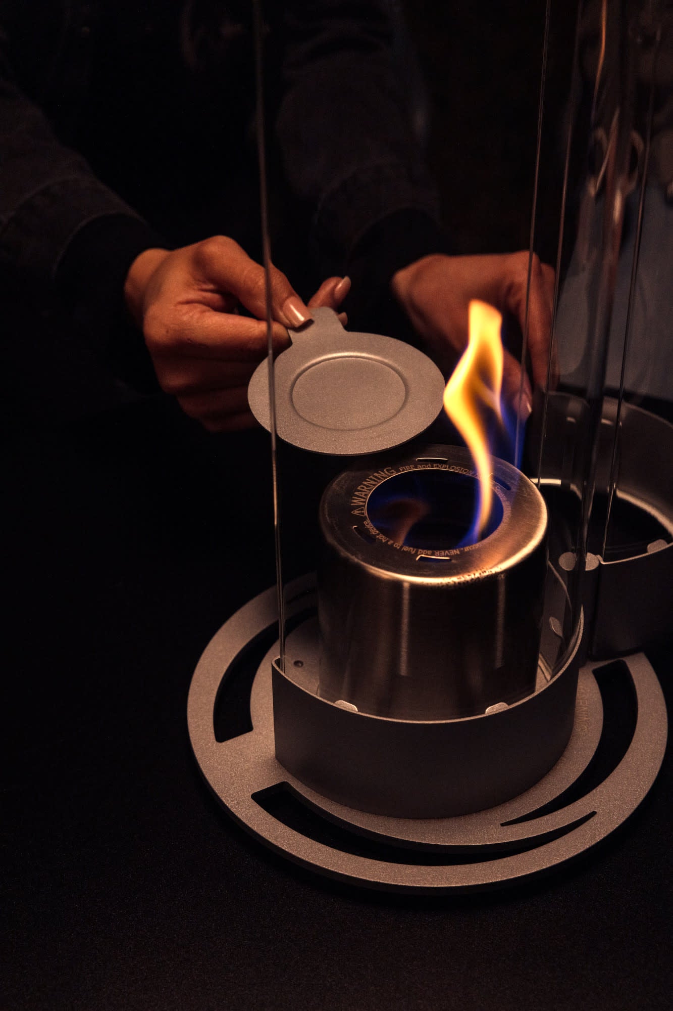 Close up of Zippo FlameScapesâ„¢ Spiral Fire Feature XL showing the snuffer covering the flame.