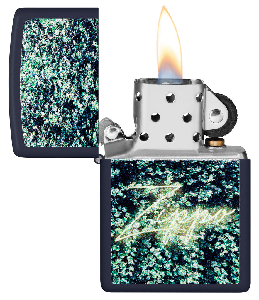 Zippo Design Navy Matte Windproof Lighter with its lid open and lit.