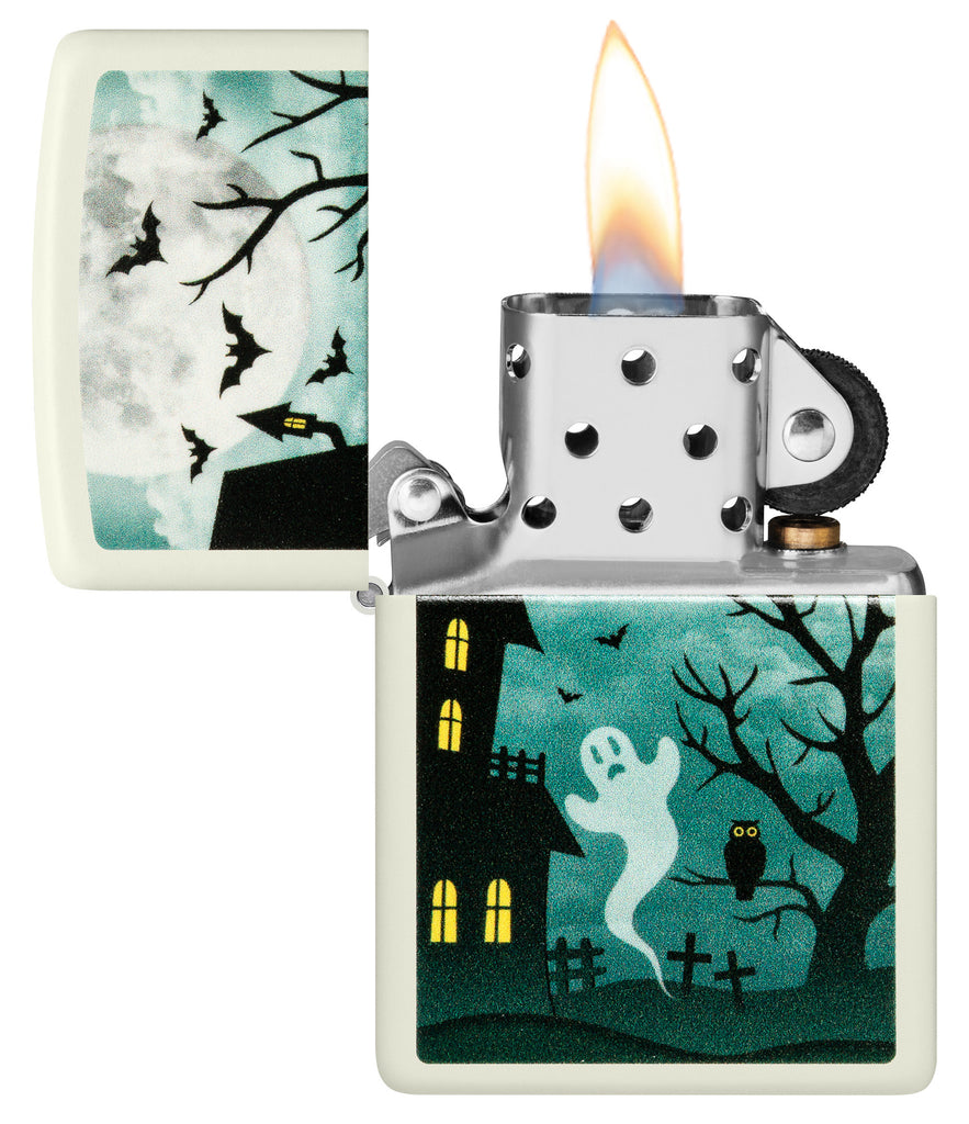 Zippo Spooky Design Glow in the Dark Green Windproof Lighter with its lid open and lit.