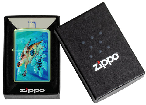 Zippo Guy Harvey High Polish Teal Windproof Lighter in its packaging.