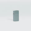 Lifestyle image of Zippo Slim Flat Grey Zippo Logo Pocket Lighter standing in a grey scene.