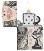 Zippo Checkmate Design 540 Matte Windproof Lighter with its lid open and lit.