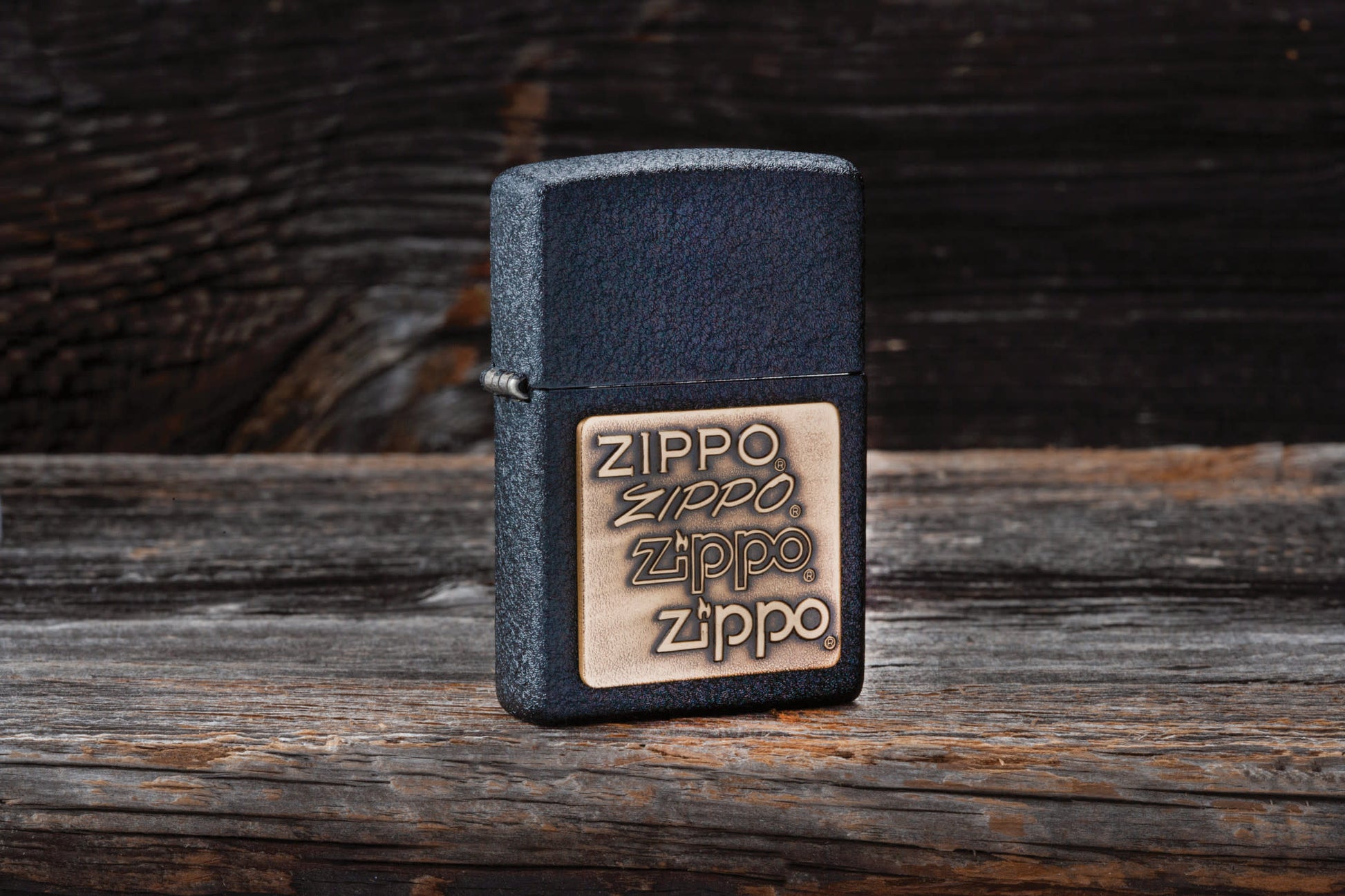 Lifestyle image of the Black CrackleÂ® Brass Zippo Logo Emblem Lighter 