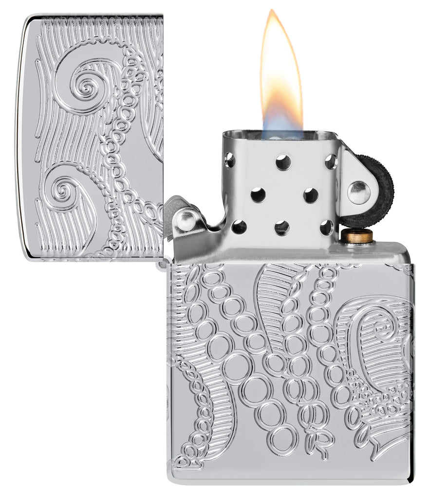 Zippo Tentacles Design Armor® High Polish Chrome Windproof Lighter with its lid open and lit.