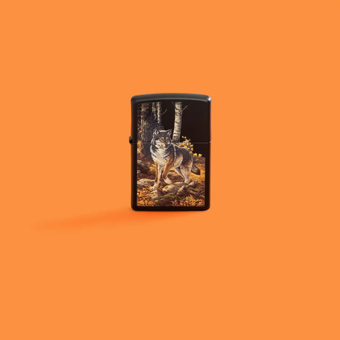 Lifestyle image of Zippo Linda Picken Black Matte Windproof Lighter on an orange background.