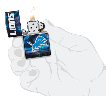 Zippo NFL Detroit Lions 540 Matte Windproof Lighter lit in hand.