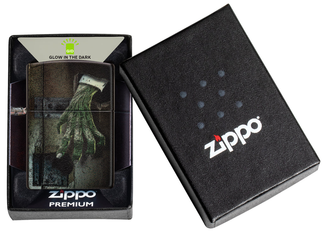 Glow In the Dark Zombie Hand Windproof Lighter in its packaging.