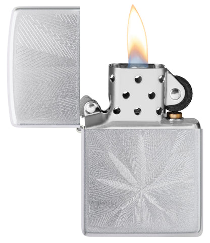 Zippo Luxury Leaf Design Satin Chrome Windproof Lighter with its lid open and lit.