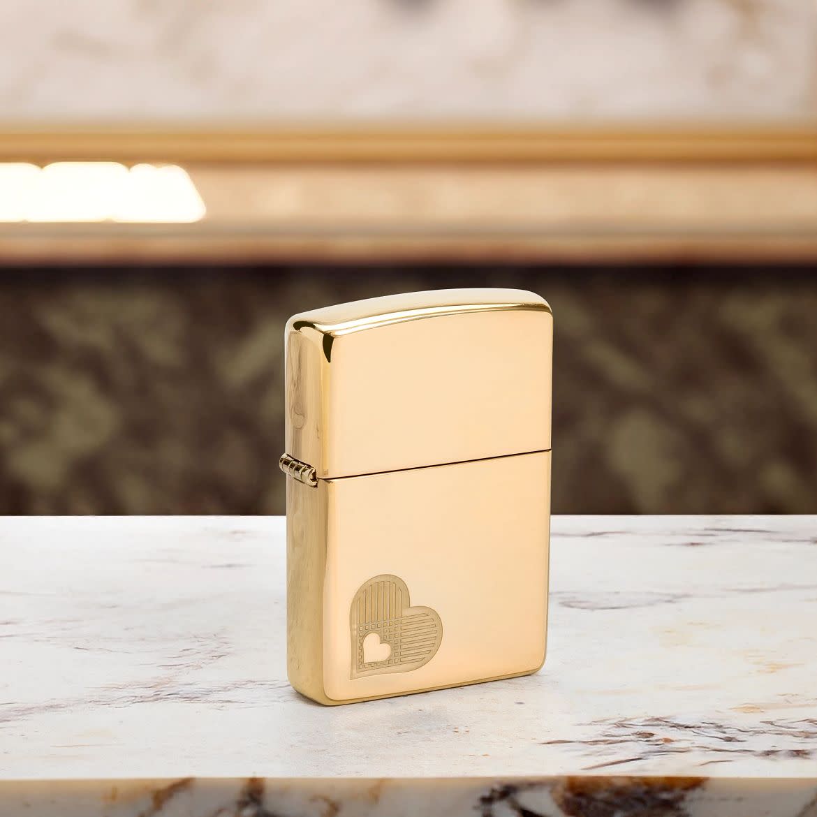 Lifestyle image of Zippo Double Hearts Design High Polish Brass Windproof Lighter standing on a marble countertop.