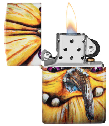 Zippo Eric Jones Halloween Glow in The Dark Windproof Lighter with its lid open and lit.