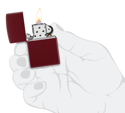 Zippo Classic Merlot Windproof Lighter lit in hand.